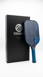 TOCO67 blue carbon fiber pickleball paddle with premium packaging box.