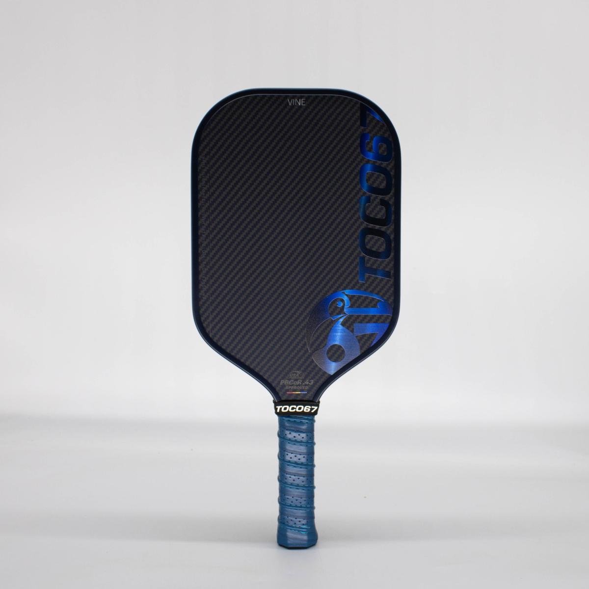 Blue Vine pickleball paddle by TOCO67 featuring a carbon fiber texture and blue grip.