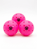 Three bright pink perforated pickleball balls with black logos on a white background.
