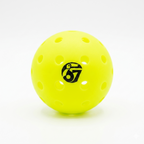 Neon yellow perforated pickleball with a black 67 logo on a white background.