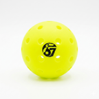 Neon yellow perforated pickleball with a black 67 logo on a white background.