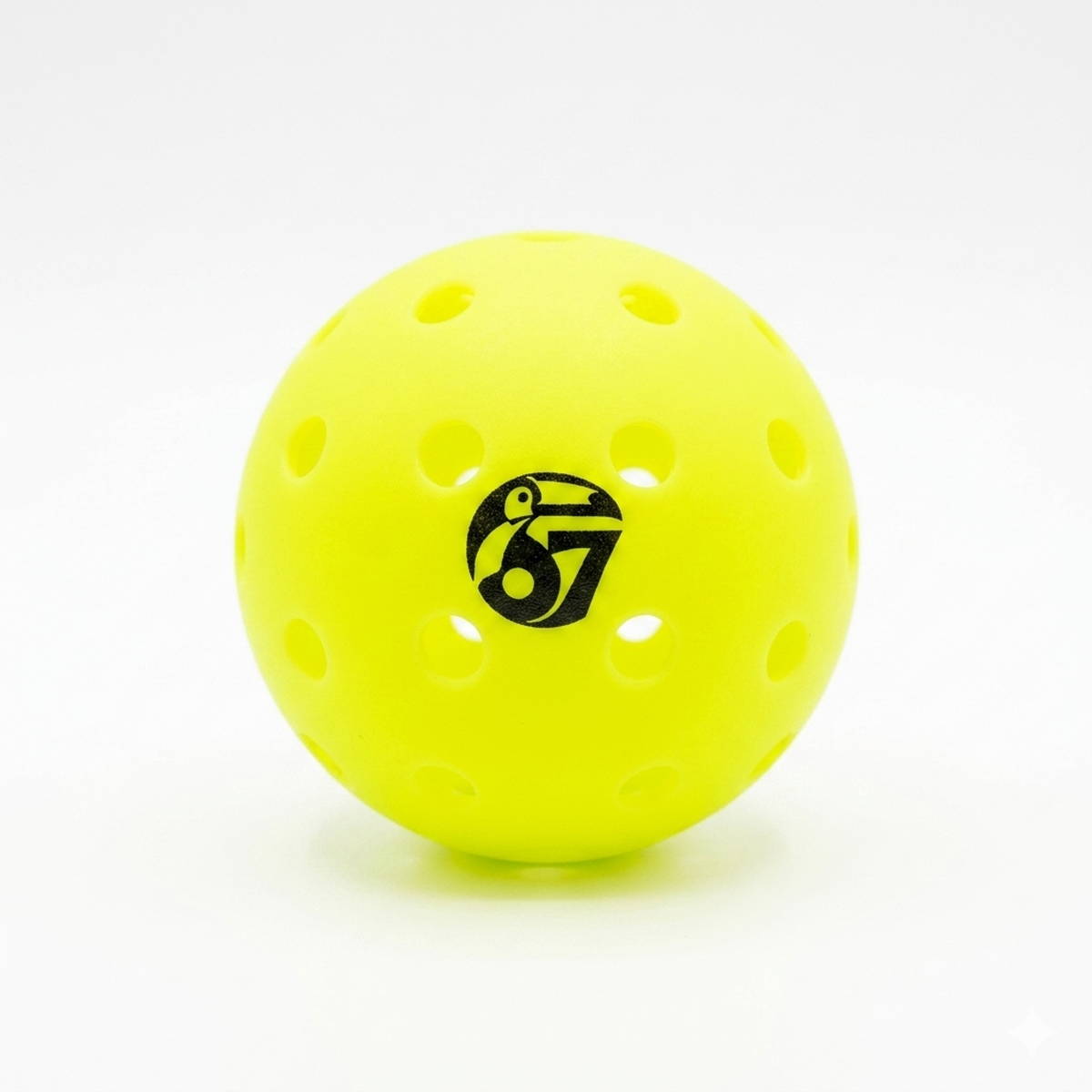 Neon yellow perforated pickleball with a black 67 logo on a white background.