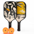 TOCO67 Play Duo Pickleball Set featuring two widebody paddles with tropical designs and two orange balls.