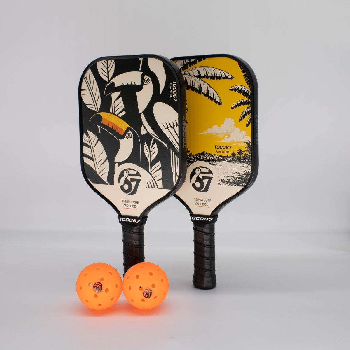 TOCO67 Play Duo Pickleball Set featuring two patterned paddles and two orange pickleballs.